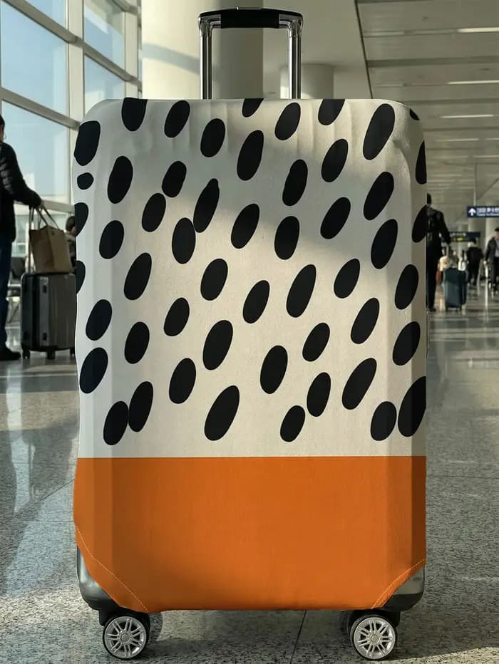 Housse de protection pour bagages contrastée de couleur orange