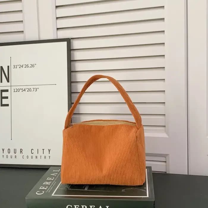 Sac carré compact à porter à la main