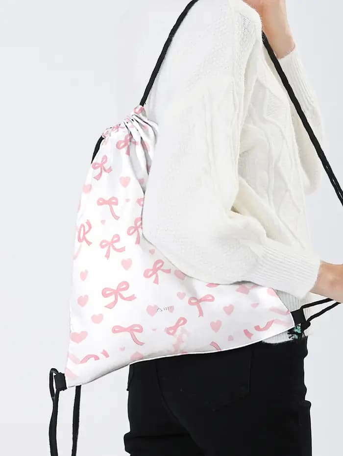 Sac à dos rose à cordon de serrage avec imprimé nœud et cœur
