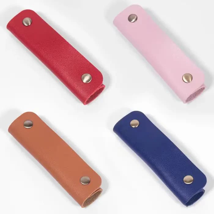 Coussinet de protection pour bandoulière et enveloppe de poignée