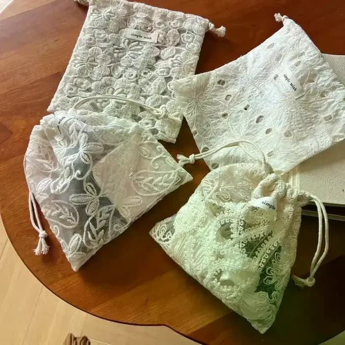 Sac en tissu prêt à l'emploi avec motif en dentelle brodée pour écouteurs