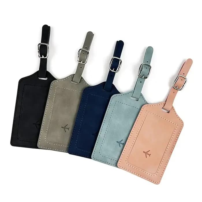 Étiquette de bagage en cuir tendance avec sac en papier de signature