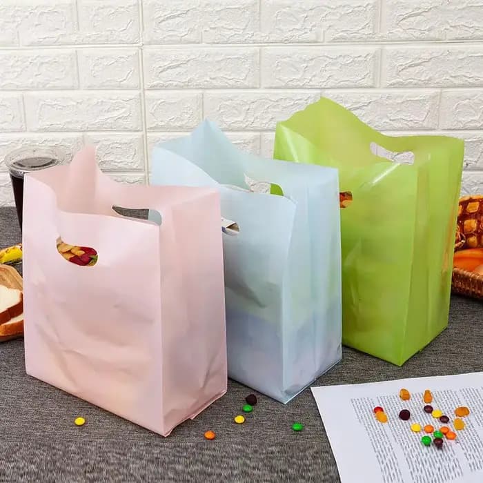 Sacs en plastique monochromes Optics avec poignée
