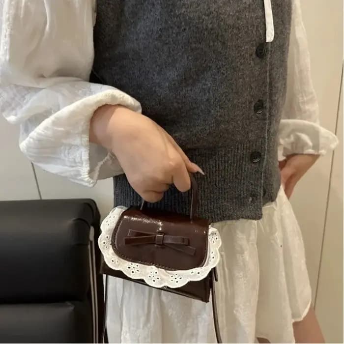 Sac bandoulière mini tendance en cuir PU avec nœud en dentelle