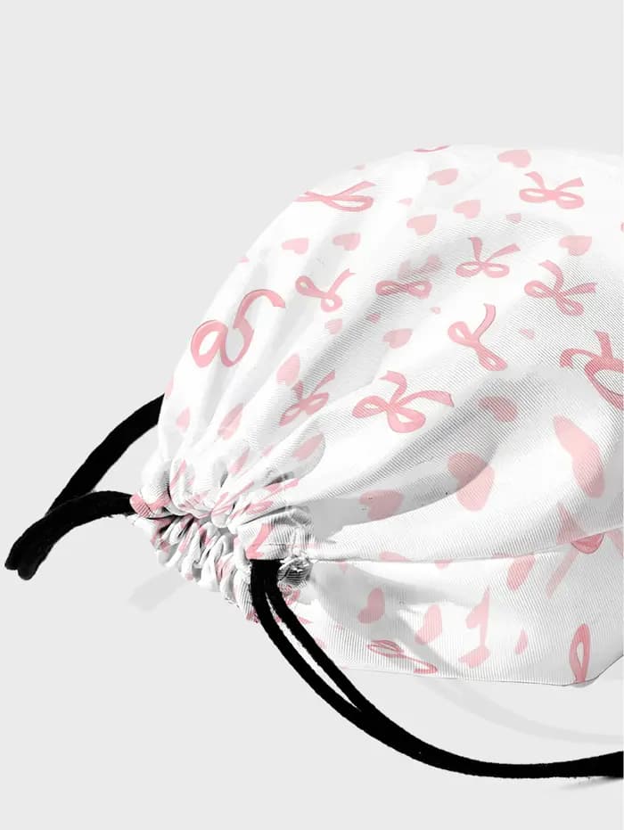 Sac à dos rose à cordon de serrage avec imprimé nœud et cœur