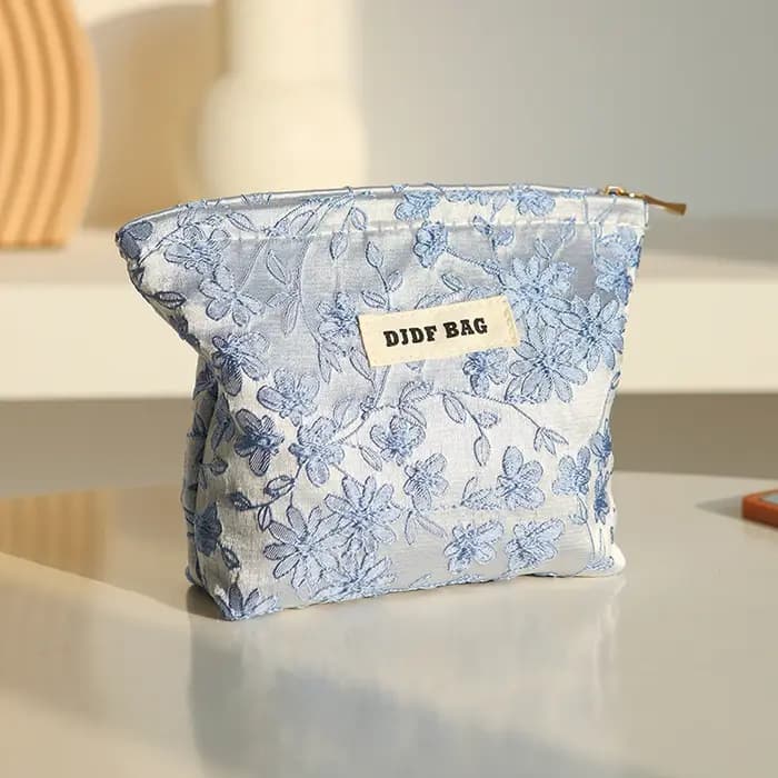 Nouveau sac cosmétique femme de petite taille Portable bleu broderie Mini sac de rangement de serviettes hygiéniques sac de clé de monnaie de banlieue sac de carte bancaire