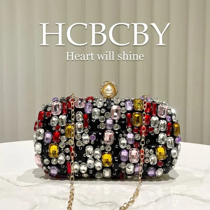 Pochette de soirée haut de gamme noire de luxe ornée de strass colorés
