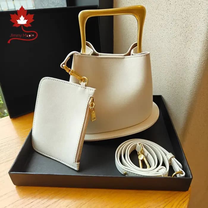 Nouveau élégant haut de gamme seau fourre-tout couleur Beige plaine Satin cuir de vache femmes sac à main poignée en métal femme sac à bandoulière petit