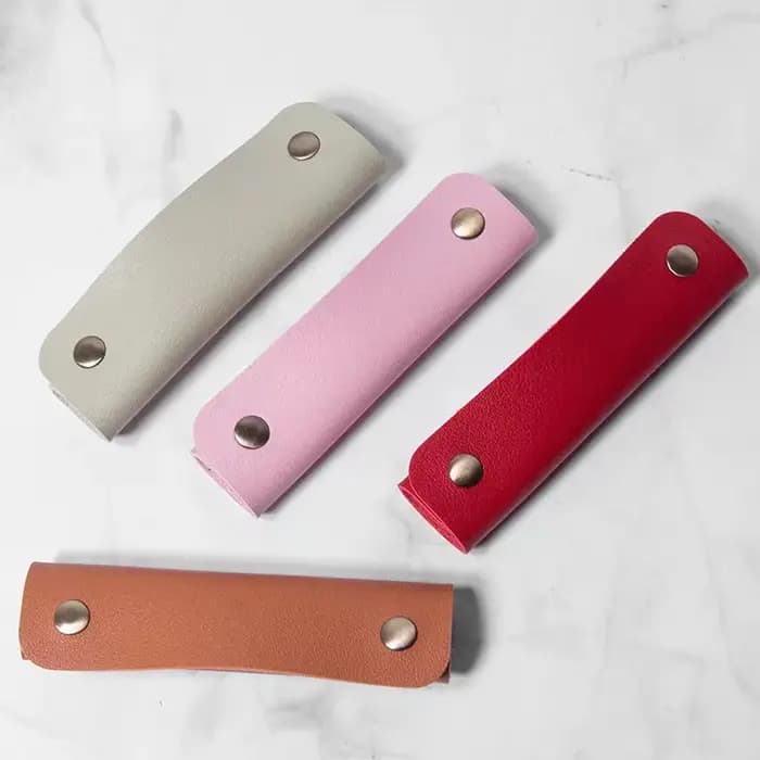 Coussinet de protection pour bandoulière et enveloppe de poignée