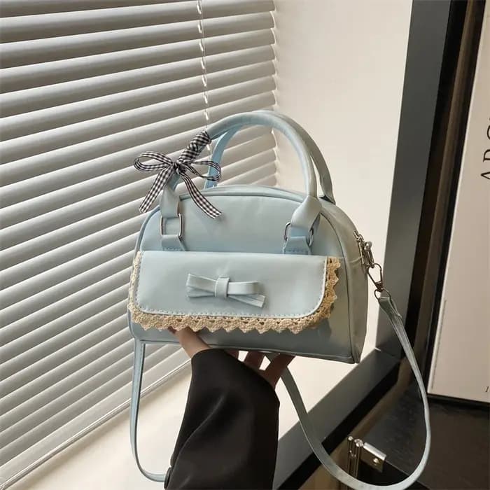 Un sac Boston polyvalent à main avec nœud papillon pour femmes en version coréenne 2025, un sac à ba
