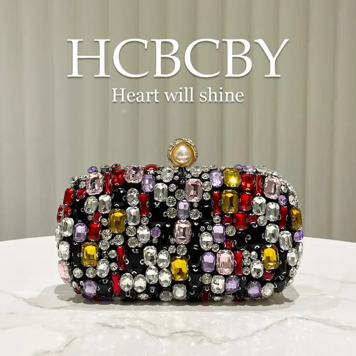 Pochette de soirée haut de gamme noire de luxe ornée de strass colorés