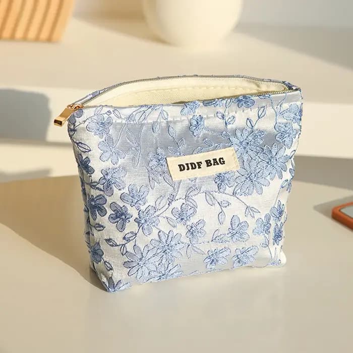 Nouveau sac cosmétique femme de petite taille Portable bleu broderie Mini sac de rangement de serviettes hygiéniques sac de clé de monnaie de banlieue sac de carte bancaire