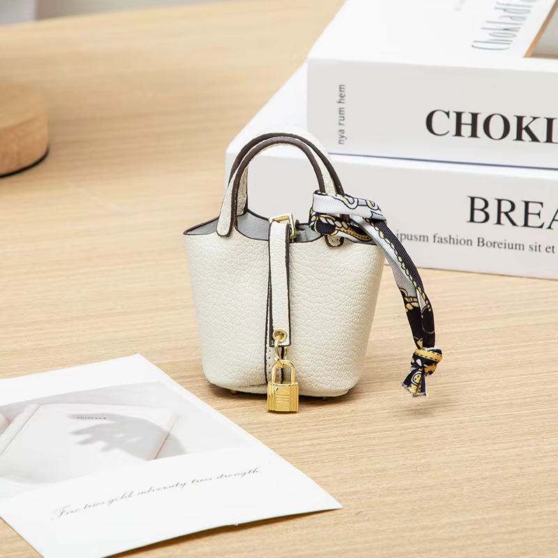 Nouveau Mini maison petit sac en cuir Portable main corde Bluetooth écouteur sac zéro portefeuille m