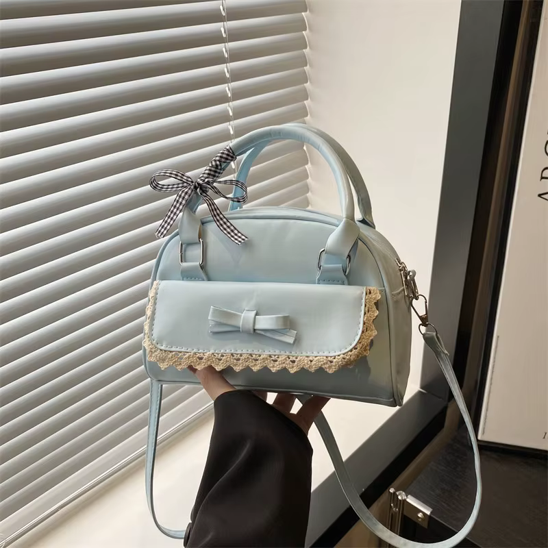 Un sac Boston polyvalent à main avec nœud papillon pour femmes en version coréenne 2025, un sac à ba
